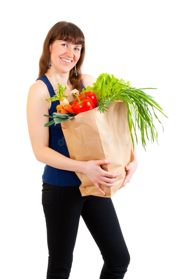 Young woman with a full grocery bag