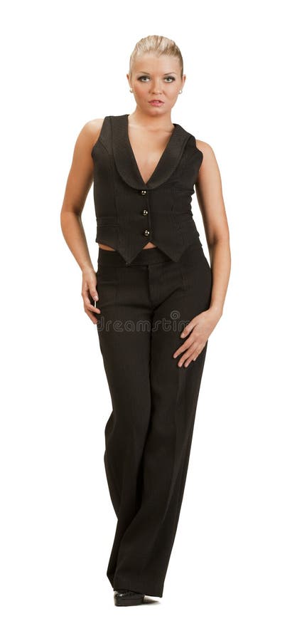 Young woman in a full-length trouser suit posing