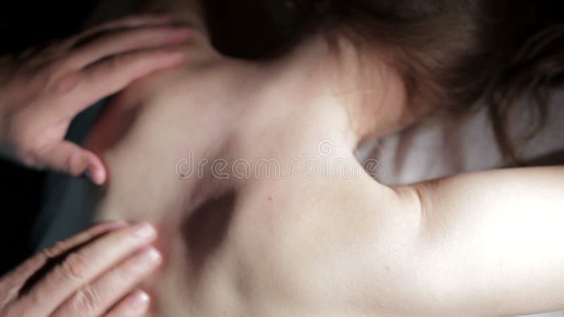 Young woman getting a back massage.