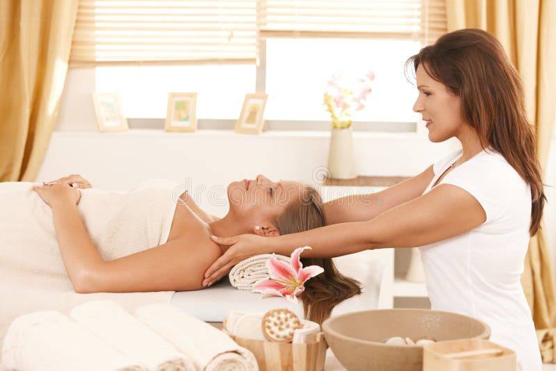Young woman getting massage in day spa