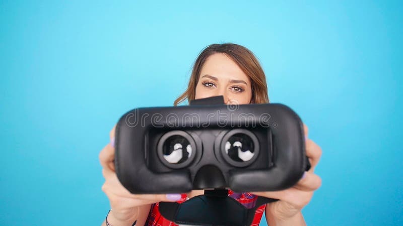 Young Woman give virtual reality goggles