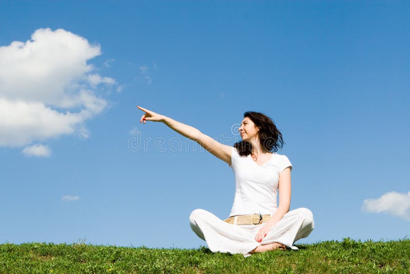 Young woman on a green meadow