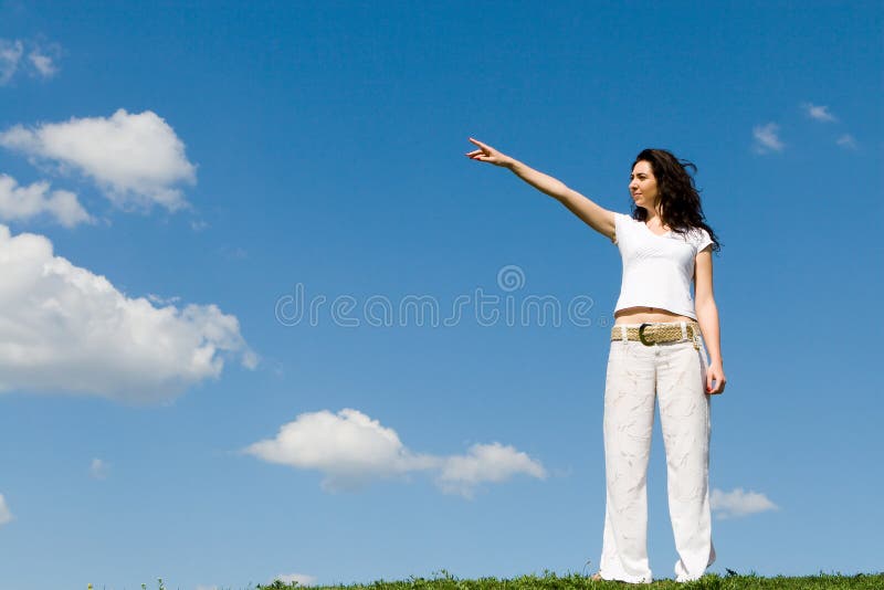 Young woman on a green meadow