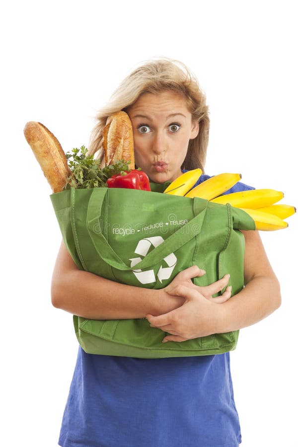 Young woman with green recycled grocery bag