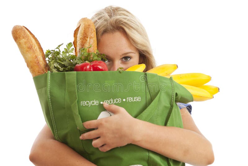 Young woman with green recycled grocery bag