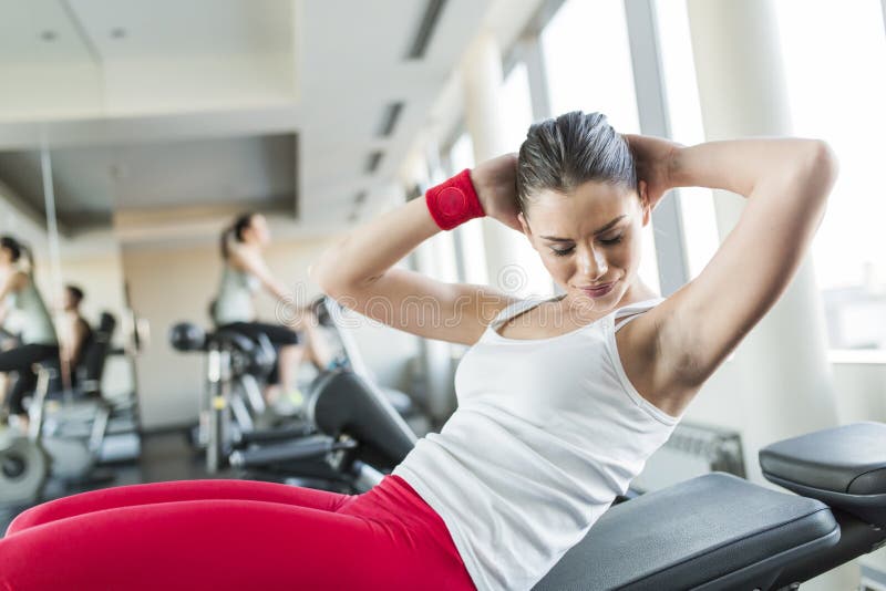 Young woman in the gym royalty free stock photography Young woman in the gym royalty free stock photography