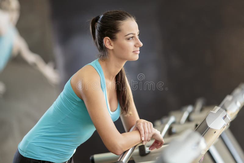 Young woman in the gym stock image. Image of equipment - 34103865