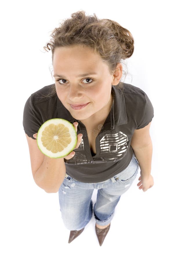 Young woman with half of a grejpfrut