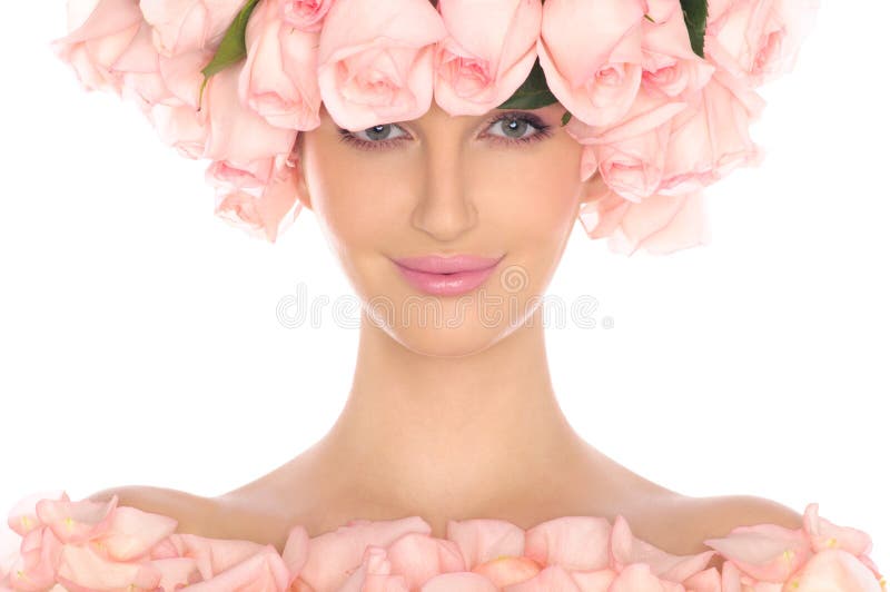Young woman in hat and dress of pink roses