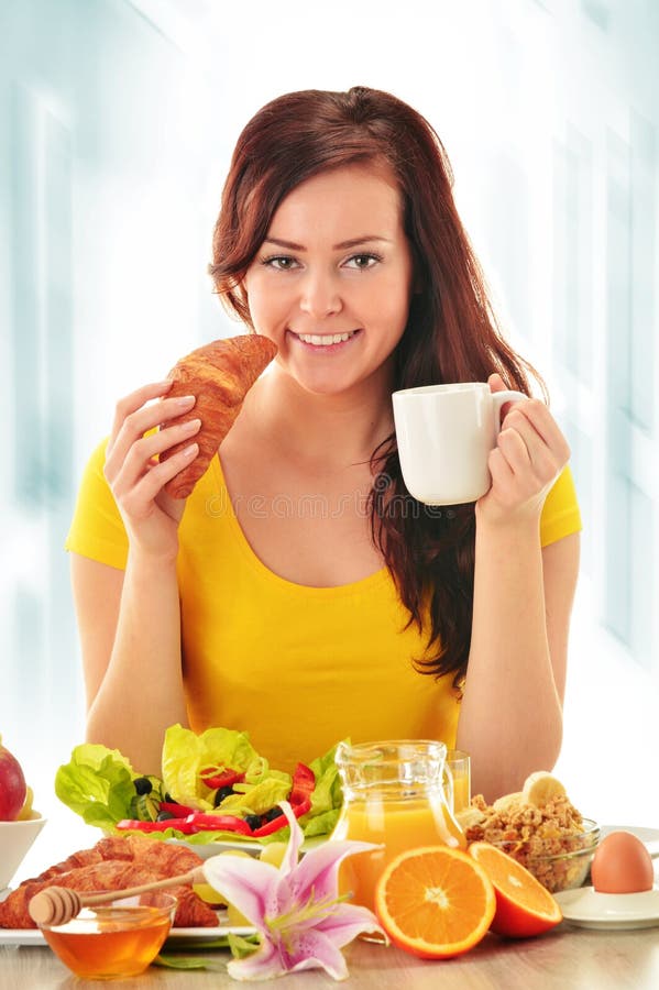 Young woman having breakfast. Balanced diet