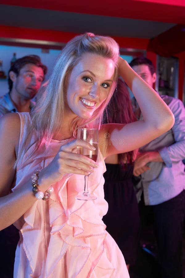 Young Woman Having Fun In Busy Bar royalty free stock images Young Woman Having Fun In Busy Bar royalty free stock images