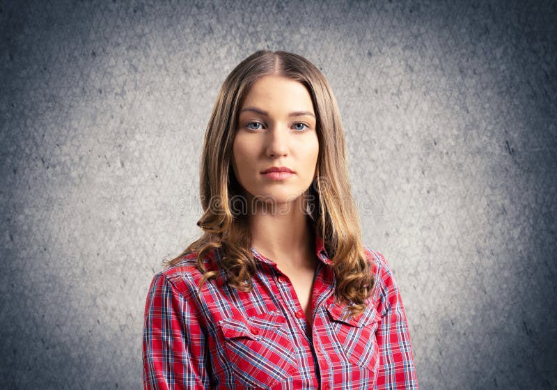 Young woman having serious and calm face