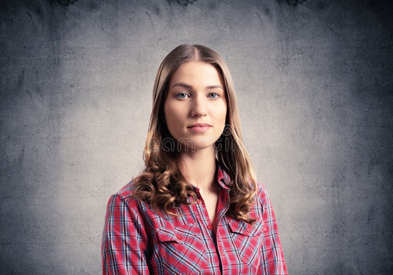 Young woman having serious and calm face