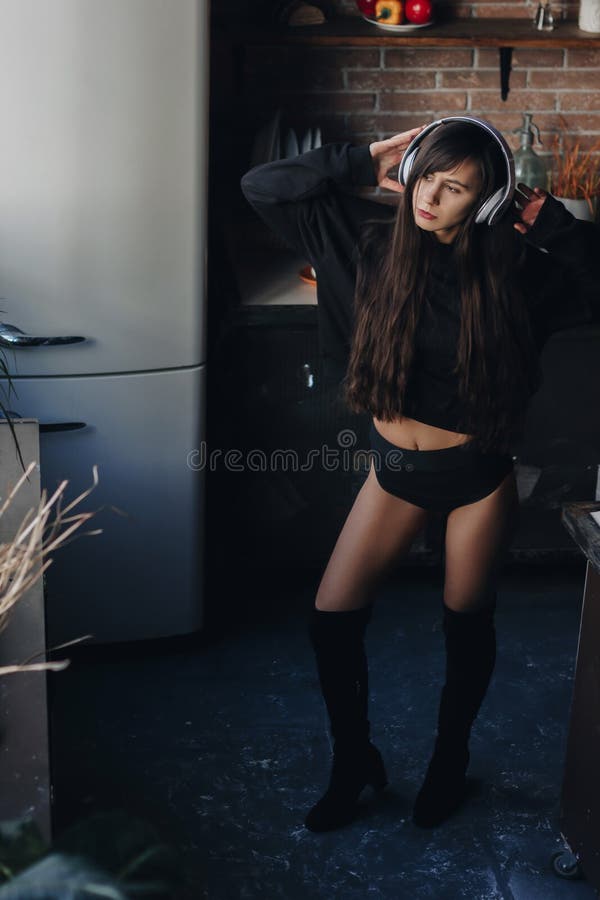 Young Woman in Headphones Dancing in the Kitchen Stock Photo Image of cooking, girl 90738530