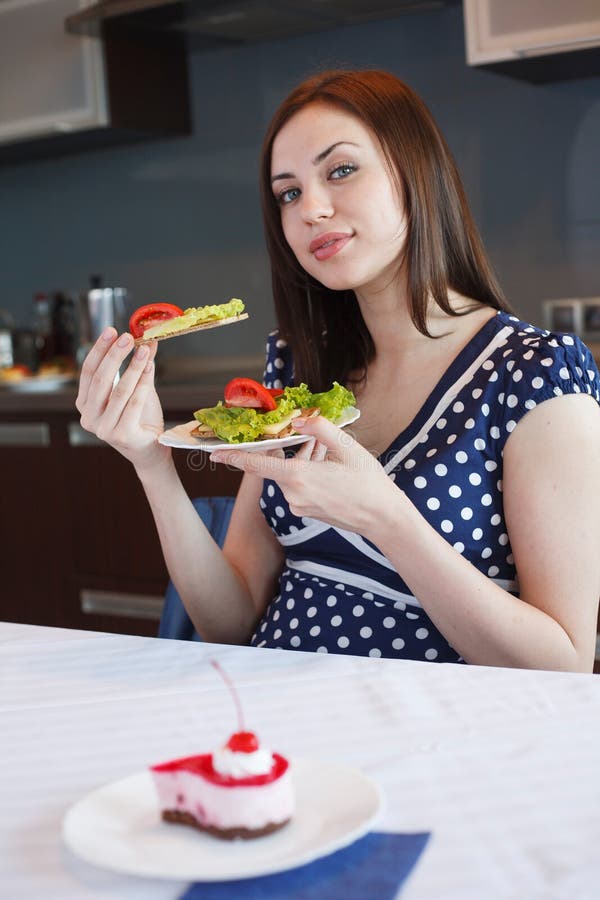 Young woman at her kitchen stock image