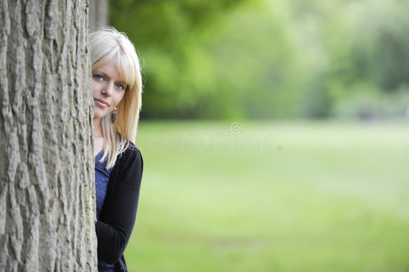 Young Woman Hiding Behind A Tree Stock Image Image Of Outside Adult 