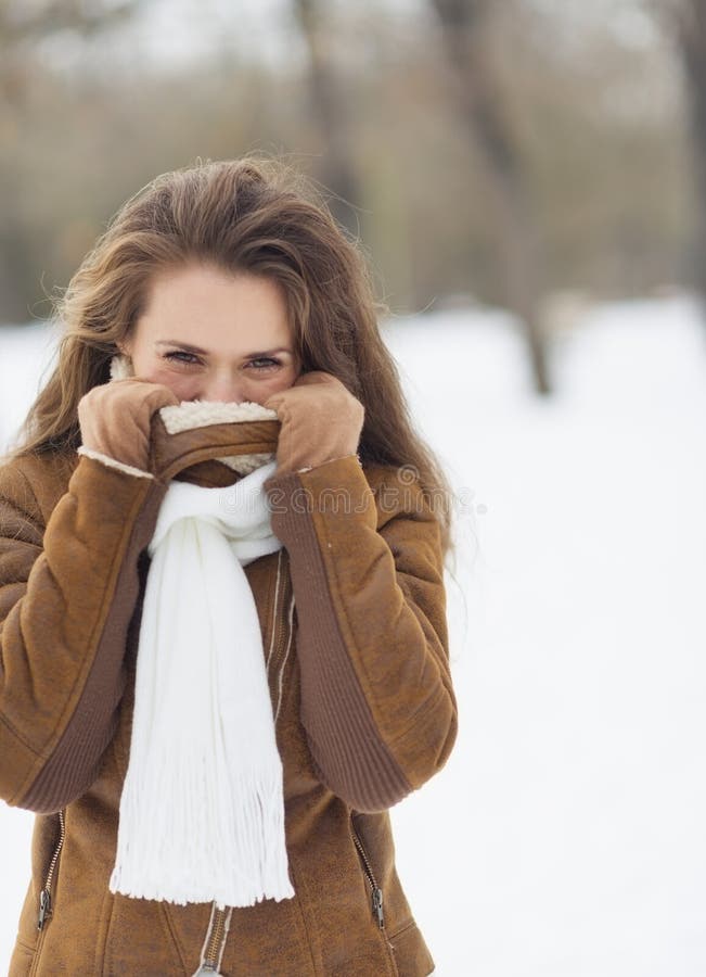 Young Woman Hiding in Winter Jacket Outdoors Stock Image Image of