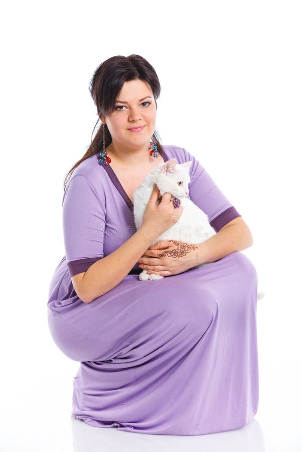 Young woman hold white cat.