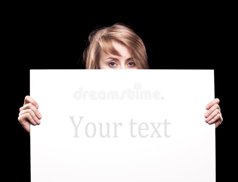 Young woman holding empty billboard