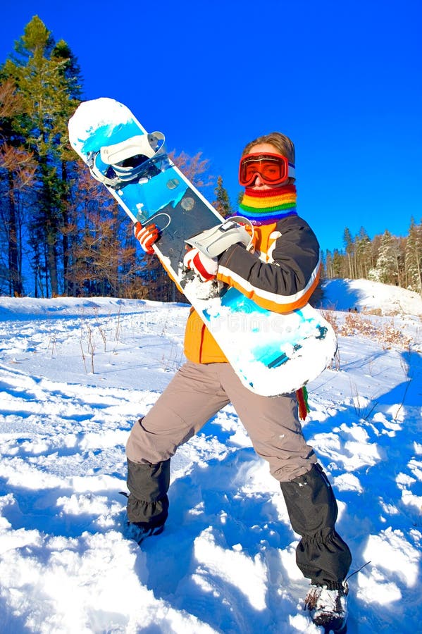 Young woman holding a snowboard