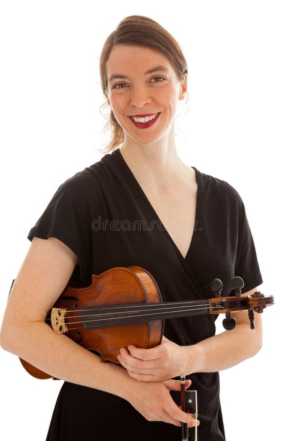 The young woman is holding a violin in her hand