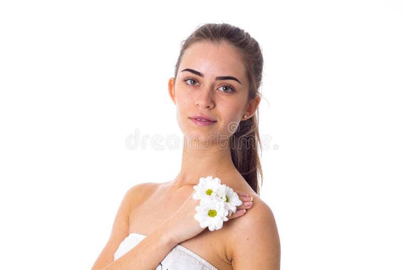 Young woman holding white flowers