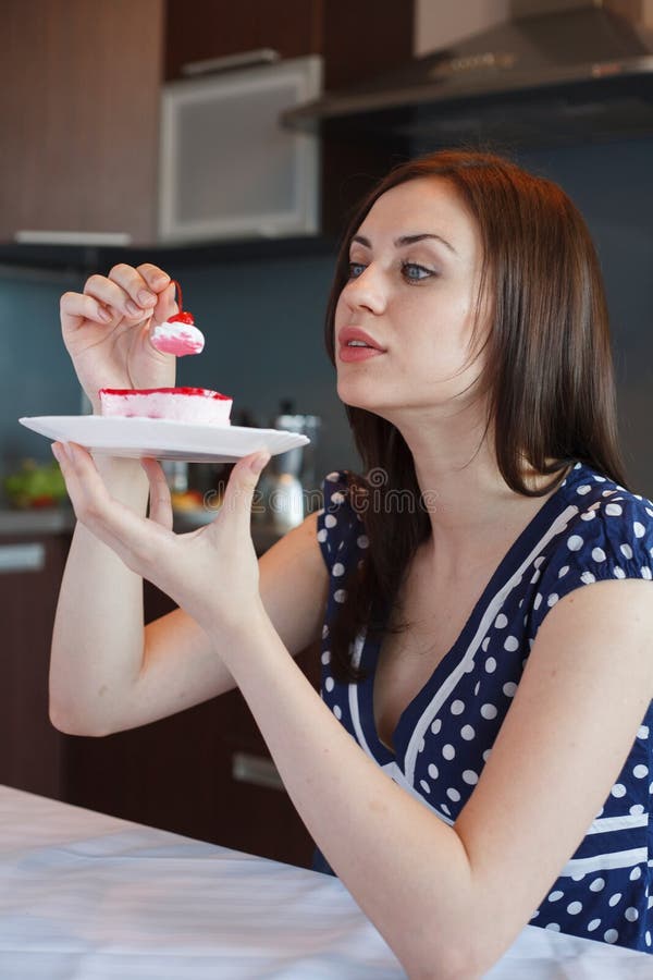 Young woman at home kitchen stock photography