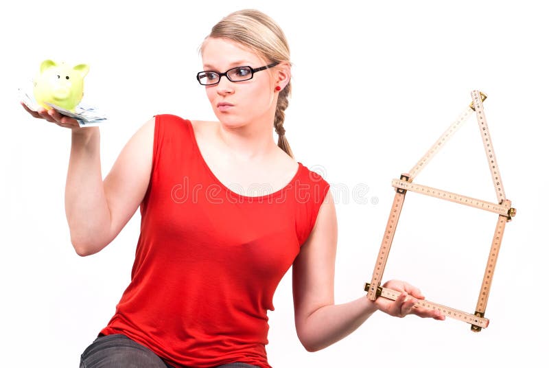 Young woman with house symbol and piggy bank