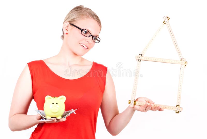 Young woman with house symbol and piggy bank