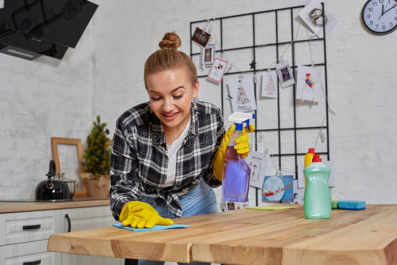 Young Woman or Housewife in Rubber Gloves Wiping Table with Microfiber ...