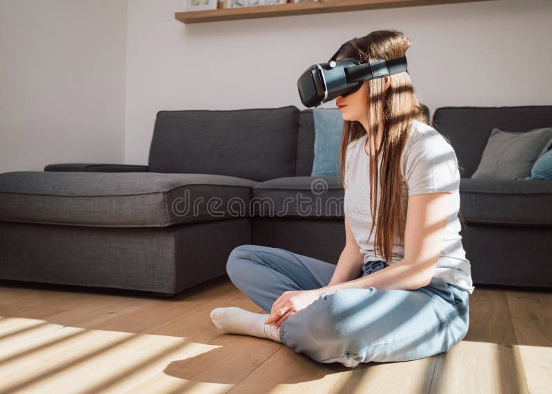 Woman Immersing In A Virtual World Using A Vr Headset Stock Image