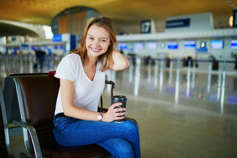 Young woman in international airport stock image Young woman in international airport stock image