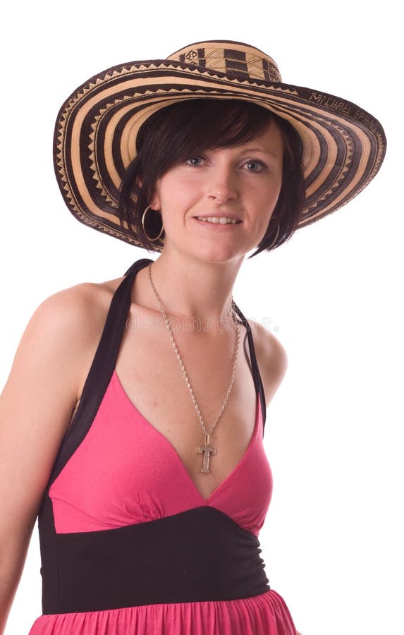 Mladá žena na sobě Kolumbijské sombrero klobouk izolované na bílém.