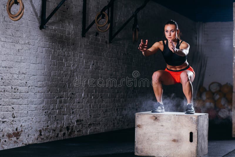 Woman Jumping Box. Fitness Woman Doing Box Jump Workout at Cross Fit Gym. Stock Photo - Image of girl, athlete: 108114776 Woman Jumping Box. Fitness Woman Doing Box Jump Workout at Cross Fit Gym. Stock Photo - Image of girl, athlete: 108114776