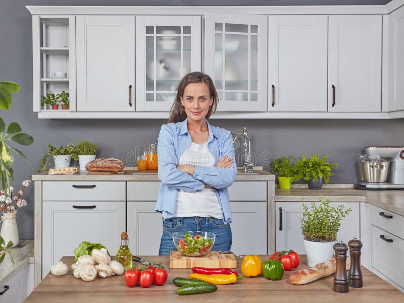 Young Woman in the Kitchen Looking at Camera Stock Image Image of
