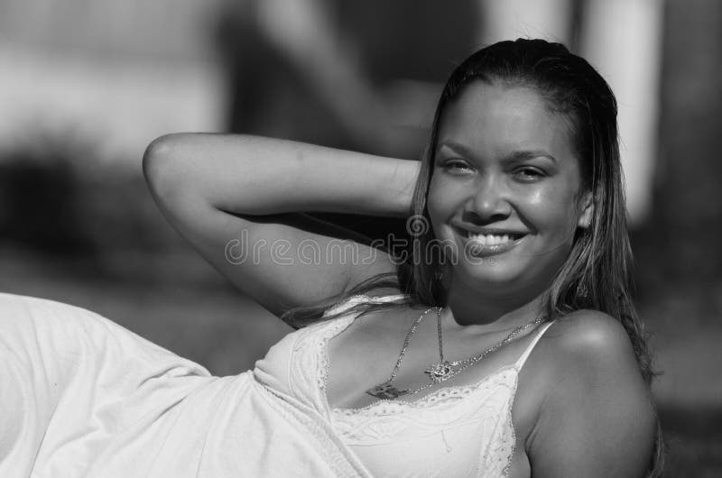 Young woman laying on grass