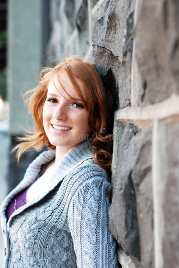 Young Woman Leaning On Wall - vertical