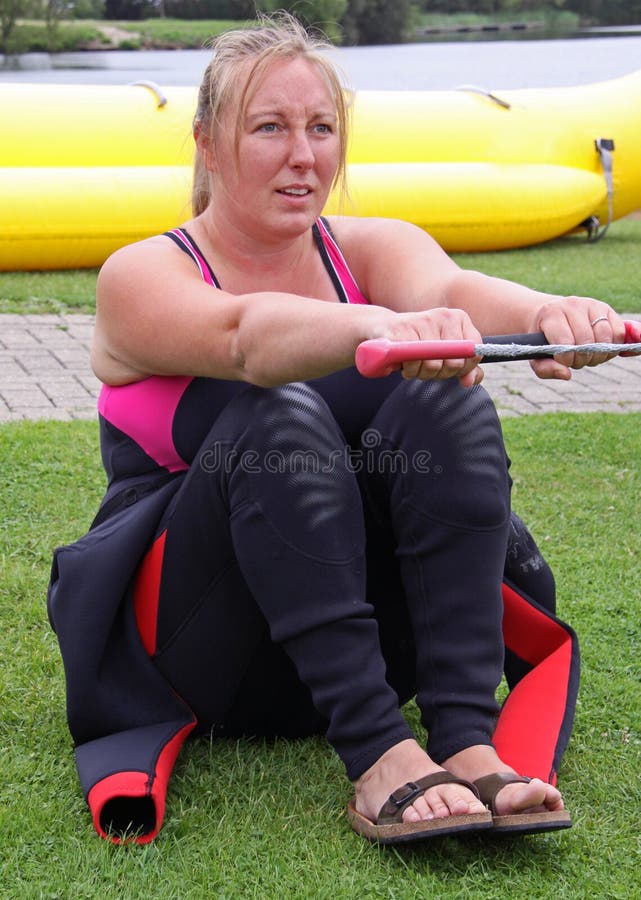 Young woman learning to water ski