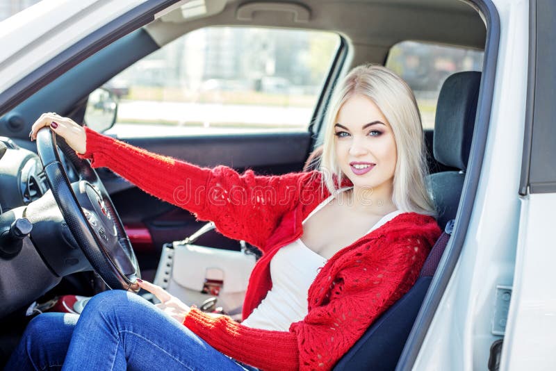 A young woman learns to drive a car. Concept trip, lifestyle, dr stock image A young woman learns to drive a car. Concept trip, lifestyle, dr stock image
