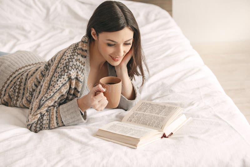 Young woman lie on bed with a book rest royalty free stock image Young woman lie on bed with a book rest royalty free stock image