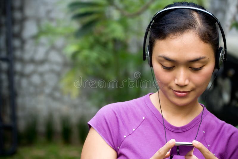 Young woman listening music