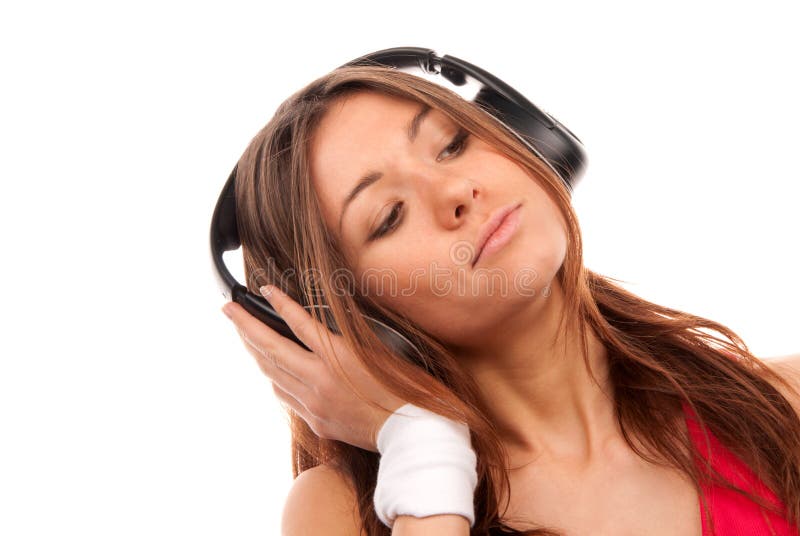 Young woman listening music in big headphones