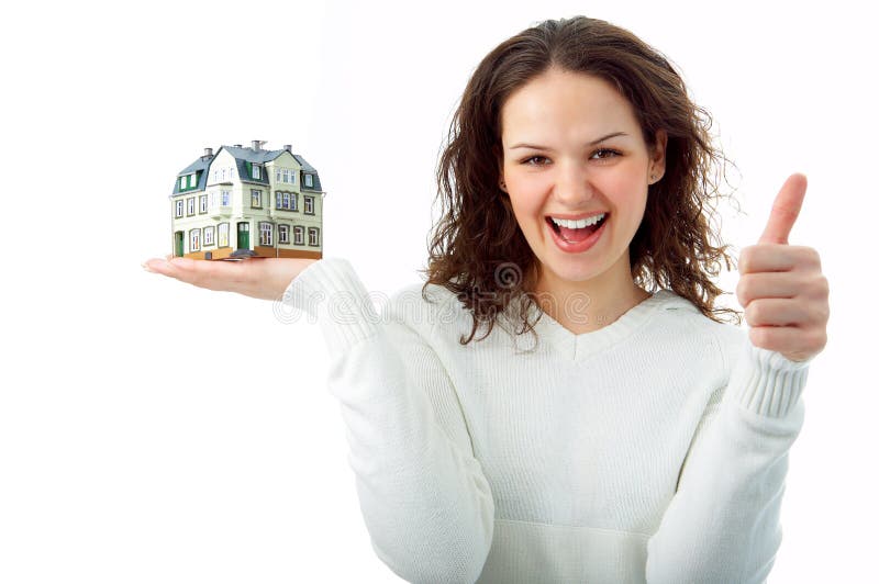 Young woman with little house in hand