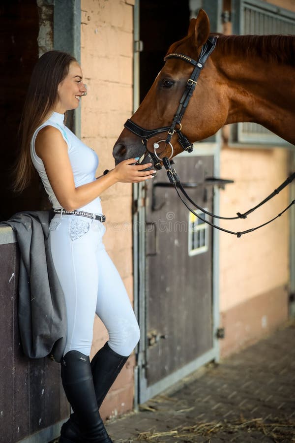 Woman Young Long Hair Brunette in Riding Clothes Leaning with Her Back ...