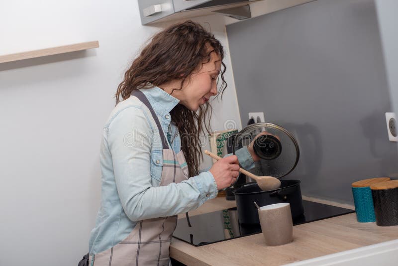 Young Woman with Long Hair is in the Kitchen Stock Photo Image of