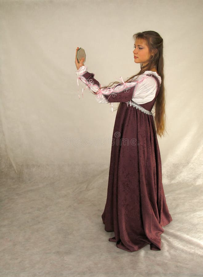 Young woman looking into the glass stock photography