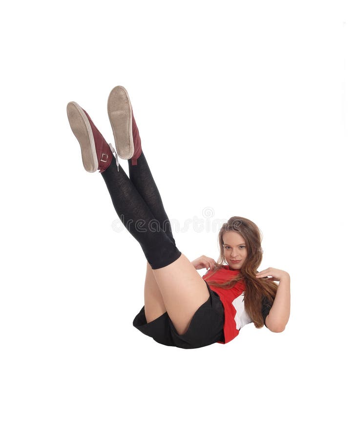 A Young Woman Lying on the Floor in the Studio Showing Her Big Long Legs  and Bottom, on a White Background. Copy Space Stock Photo - Image of legs,  fitness: 181216346