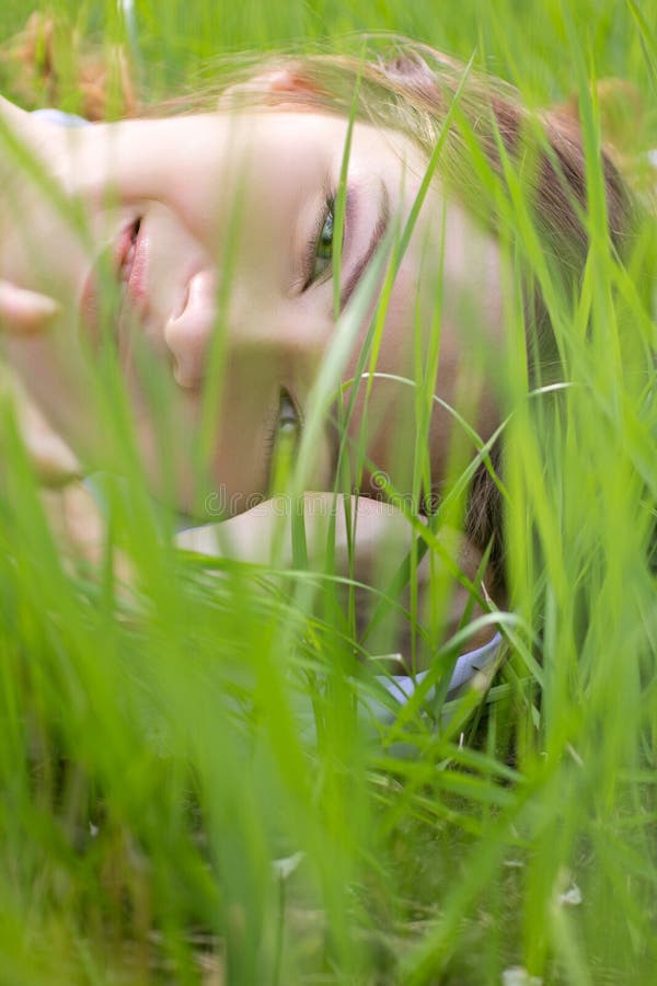 Man Lying on Grass in Fetal Position Stock Image - Image of photograph ...