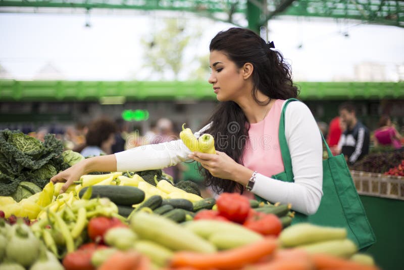 Young woman on the market royalty free stock images Young woman on the market royalty free stock images