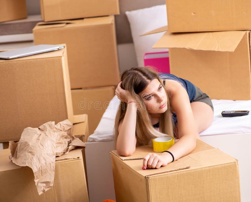 Young Woman Moving To New Place Stock Image - Image of boxes